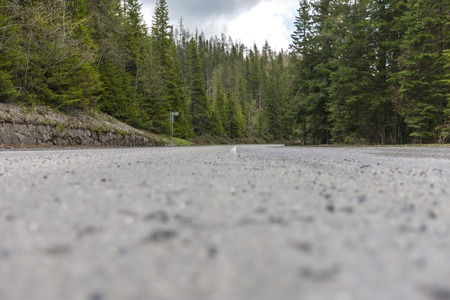 Winding road bends in a rural, desolate, mountain landscape in Slovakia, Europe.の写真素材