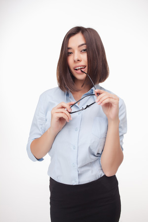 The picture of a beautiful business woman with glasses on white backgroundの写真素材