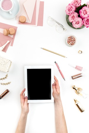 The female hands and tablet against fashion woman objects on white. Concept of female mockup and comfortable  female workplaceの写真素材