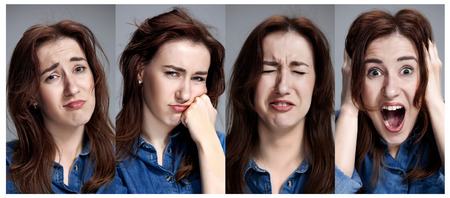 Set of young woman's portraits with different emotions on gray background. Concept headache and toothacheの写真素材