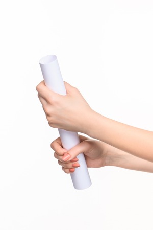 The white cylinder of the props in the female hands on white background with  right shadowの写真素材