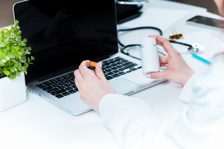 Healthcare and medical concept. Doctor with pill in hospitalの写真素材