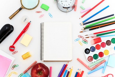 School set with back to school inscription, notebooks, pencils, brush, scissors and apple on white...