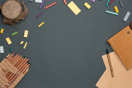 Office desk table with pencils, supplies and cup. Top view with copy spaceの写真素材