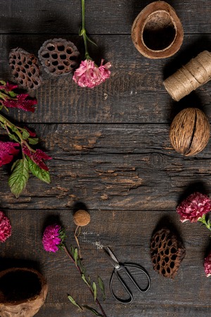 The florist desktop with working tools on wooden backgroundの写真素材