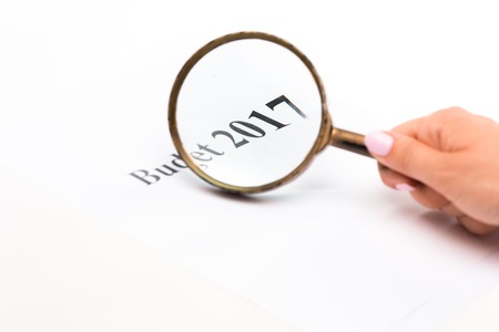 Magnifying glass on Budget 2017 text on paper - business, banking, finance conceptの写真素材