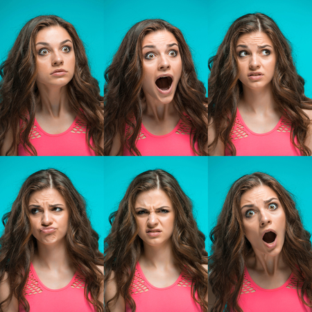 The young woman's portrait with different emotions on blue background. Collageの写真素材