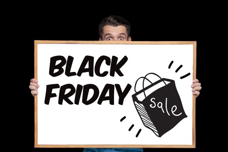 Black Friday sale - holiday shopping concept - text on board on blackの写真素材