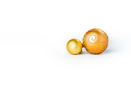 Gold Christmas balls on white background. Copy Space.の写真素材