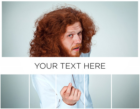 The young man with long red hair looking at camera luring someoneの写真素材