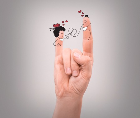 happy couple in love with painted facesの写真素材