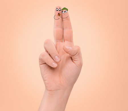 happy couple in love with painted facesの写真素材