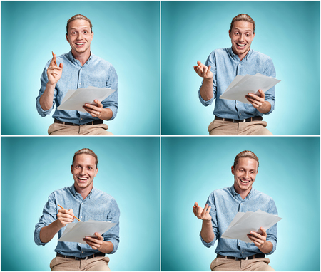 Smart smiling student with great idea holding sheets of paperの写真素材