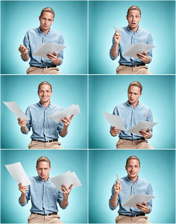 Smart smiling student with great idea holding sheets of paperの写真素材