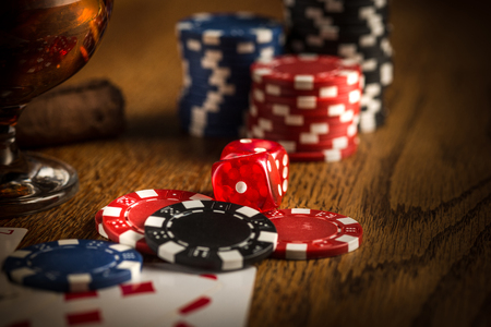 Cigar, chips for gamblings, drink and playing cards