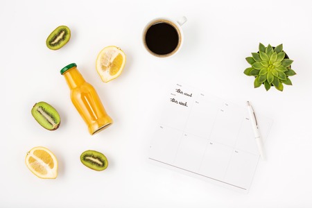 Top view of white office female workspace with notebookの写真素材