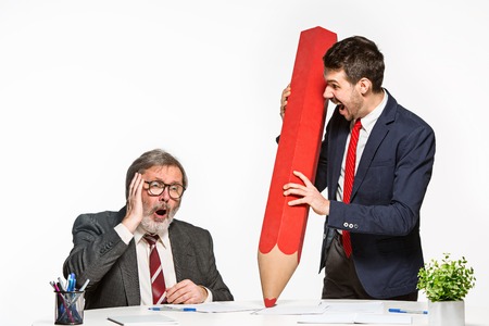 The two colleagues working together at office on white background.の写真素材