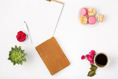 Top view of white office female workspace with notebookの写真素材