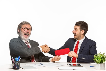 Concept - corruption. Businessman in a suit taking a bribeの写真素材