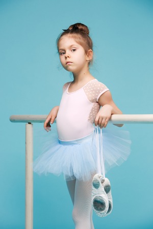 The little balerina dancer on blue backgroundの写真素材