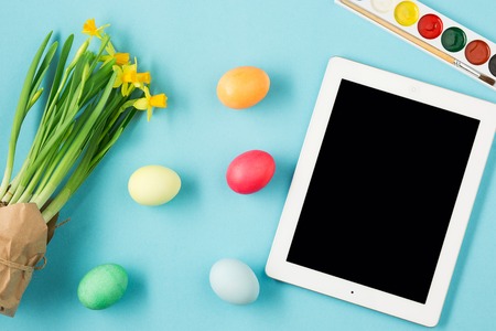 The top view of easter on blue table office workplace