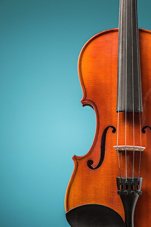 The violin front view on blueの写真素材