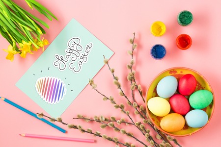 The top view of easter on pink table office workplace