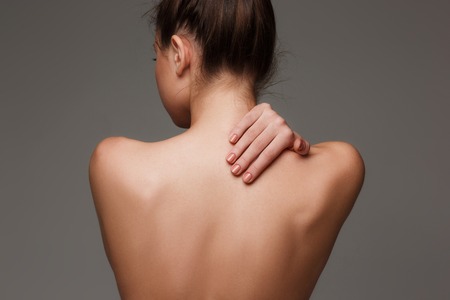 The beautiful womans body on gray backgroundの写真素材