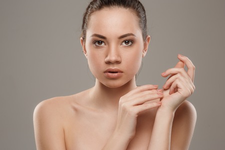 The beautiful female face. The perfect and clean skin of faceの写真素材