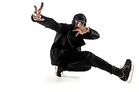 The silhouette of one hip hop male break dancer dancing on white backgroundの写真素材
