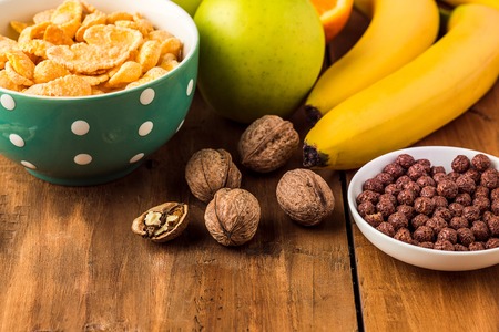 Healthy home made breakfast of muesli, apples, fresh fruits, walnuts. Served with fresh, sliced...