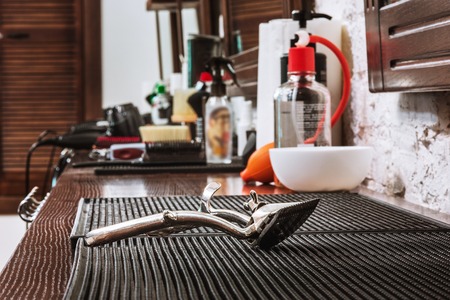 Barber shop equipment on wooden background.の写真素材