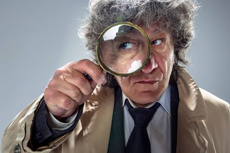 The senior man as detective or boss of mafia on gray studio backgroundの写真素材