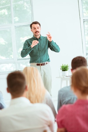 Speaker at Business Meeting in the conference hall.