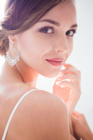 Beautiful bride in wedding dress, white backgroundの写真素材