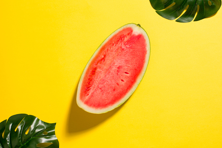 Watermelon on yellow backgroundの写真素材