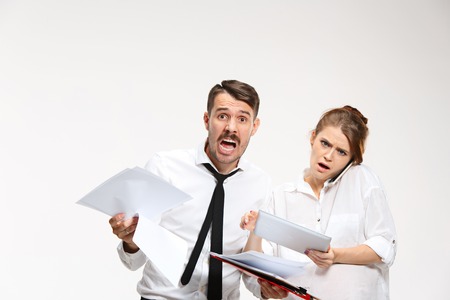 The business man and woman communicating on a gray backgroundの写真素材