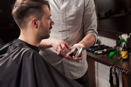 Hipster client visiting barber shopの写真素材