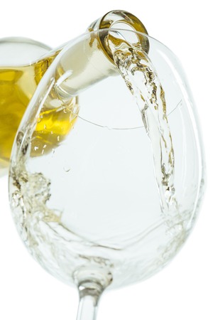 The white wine jet with glass and bottle close upの写真素材