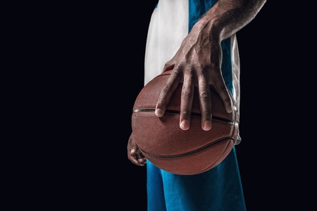 The portrait of a basketball player with ballの写真素材