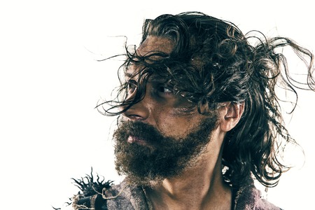 Portrait of a brutal bald-headed viking in a battle posing against a white background.の写真素材