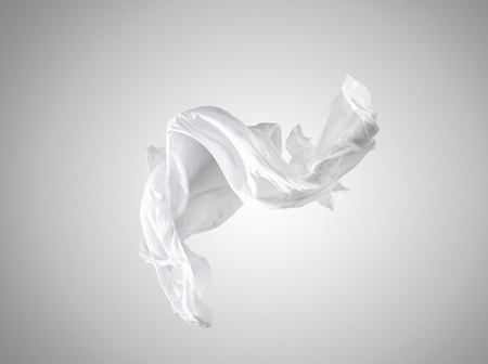 Smooth elegant transparent white cloth separated on gray background.の写真素材