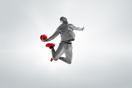 Full length portrait of a basketball player with ballの写真素材