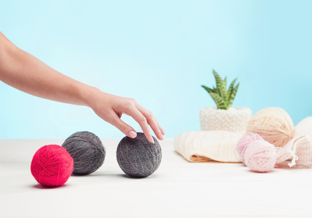 The balls of wool on white wooden backgroundの写真素材