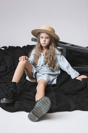 Stylish young teen girl over gray backgroundの写真素材