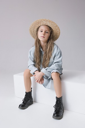 Stylish young teen girl over gray backgroundの写真素材