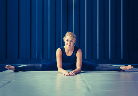 Concept: power, strength, healthy lifestyle, sport. Powerful attractive muscular woman at CrossFit gymの写真素材