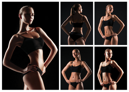 Muscular young woman athlete on blackの写真素材