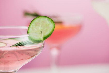 The rose exotic cocktails and fruits on pink