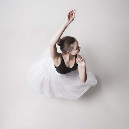 The top view of the teen ballerina on white backgroundの写真素材